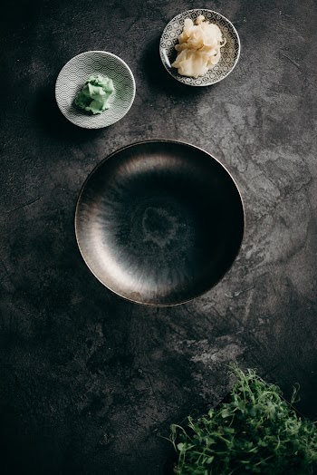 Stainless Steel Round Plate on Black Textile