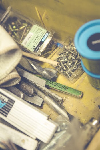 Stainless Steel Screw Near Blue Tin Can