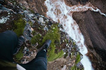 Standing At Waterfalls Edge