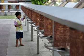 Standing Boy Near Wall