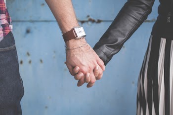 Standing couple holding hands