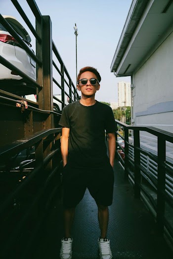Standing Man Beside Railing