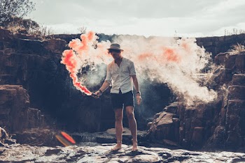 Standing Man Holding Smoke Bomb