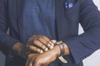 Standing Man Looking His Watch