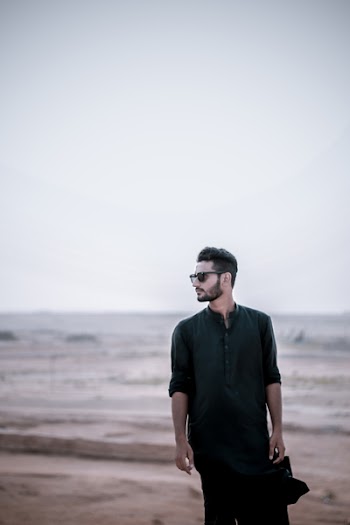 Standing Man Wearing Black Coat on Ground