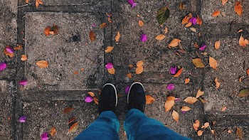 Standing Person Wearing Blue Pants and Black Low-top Sneakers