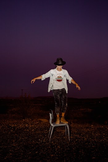 Standing Person Wearing White Button-up Jacket