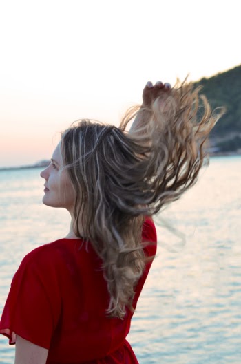 Standing Woman Facing Body of Water