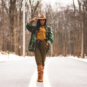Standing Woman Holding Brown Cowboy Hat