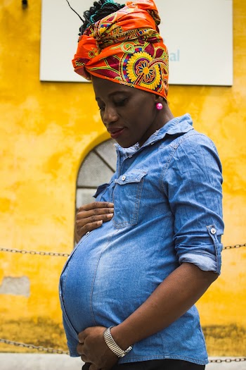 Standing Woman Holding Her Belly