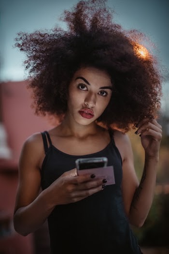 Standing Woman Holding Smartphone