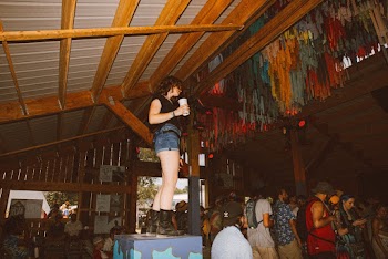 Standing Woman Holding White Cup