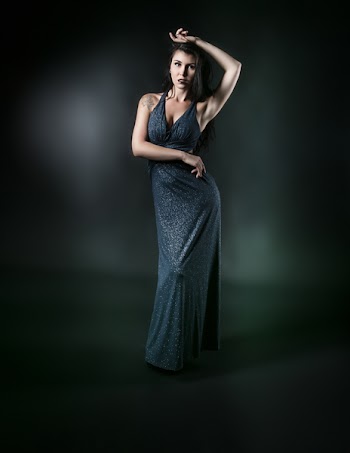Standing Woman in Gray Surplice Sleeveless Dress