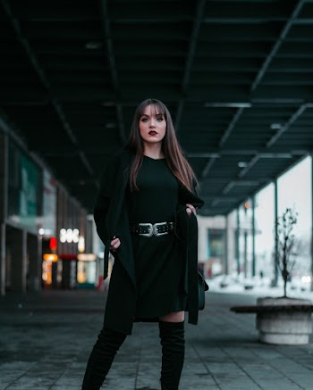 Standing Woman Wearing Black Crew-neck Dress and Cardigan