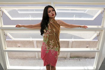 Standing Woman Wearing Brown and Pink Floral Dress Near Window