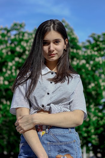 Standing Woman Wearing Gray Striped Button-up Shirt