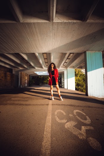 Standing Woman Wearing Red Blazer at Parking Lot