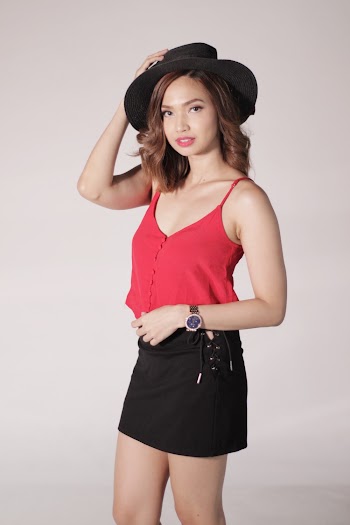 Standing Woman Wearing Red Camisole and Black Mini Skirt