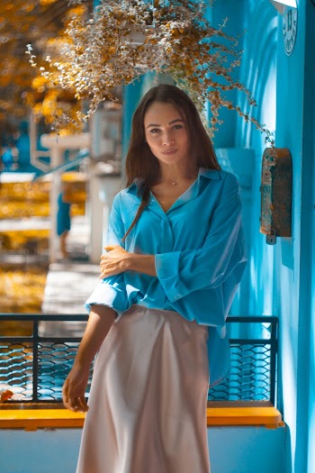 Standing Woman Wearing Teal Shirt