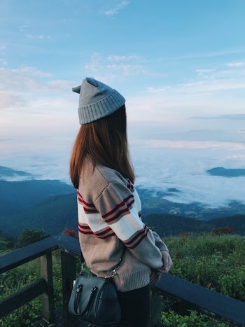 Standing Woman Wearing White and Gray Sweater