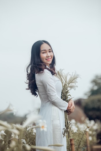 Standing Woman Wearing White Long-sleeved Dress
