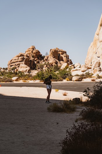 Standing Woman Wearing White Shorts