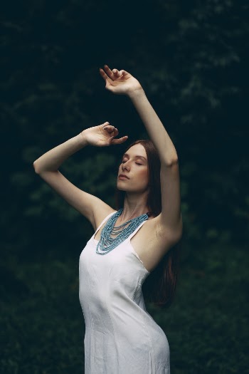 Standing Woman Wearing White Sleeveless Dress