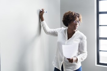 Standing Woman Writing on Wall