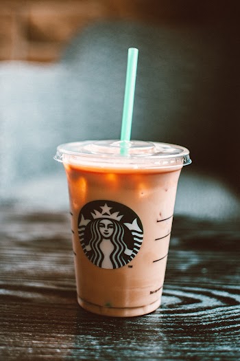 Starbucks Cold Beverage On Table With Straw