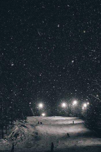 starry sky over tundra and lights
