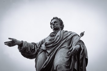  Statue of a Man Holding Staff