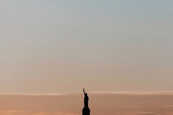 Statue of Liberty silhouette during daytime