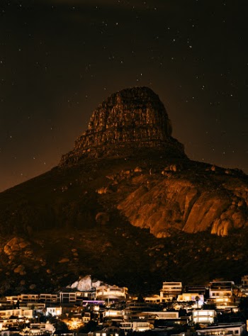 Staying overnight in Bantry Bay, Cape Town gave me a view of the dark side of the iconic Lion’s Head in South Africa’s ‘Mother City’. Snapped this vertical frame through my bedroom window and added some warmth to bring out the glow from the rock face of the mountain.
