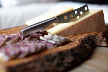 Steel Knife on Chopping Board