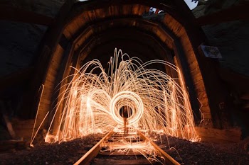 steel photography of light inside arch