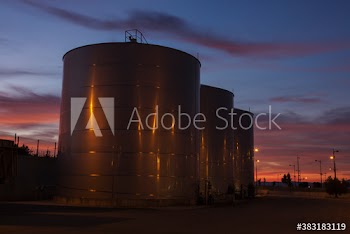 Steel storage tanks at dusk