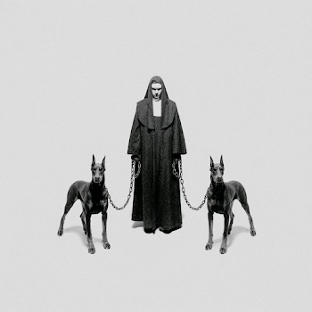 Stern Nun with Aggressive Doberman Pinschers