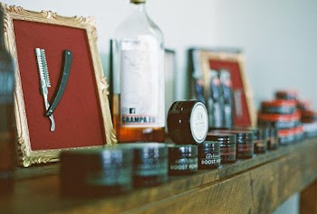 Straight Razor and Cream Jars on Wooden Surface