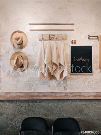 Straw hat and hanging beach towels
