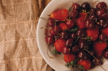 Strawberries and Cherries in White Ceramic Bowl on Newspaper · Free Stock Photo