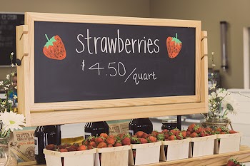 Strawberries for 4.50 Per Quartz Signage Above Bunch of Strawberries