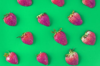 Strawberries on Green Background
