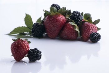 Strawberries On White Surface
