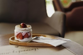 Strawberry Cake in Jar Beside Spoon