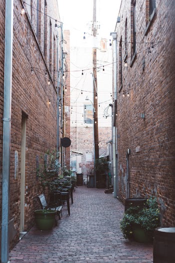 Street Alley Between Brown Bricked Houses