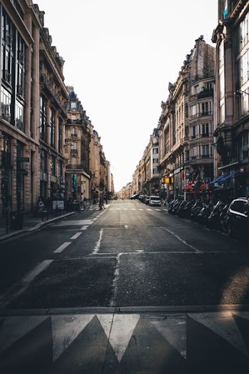 street between brown concrete buildings during daytime