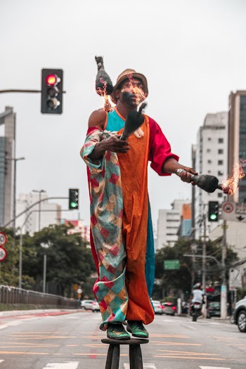 Street Performer Standing on a Stool