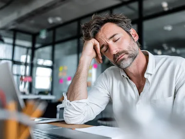 Stressed Businessman in Modern Office Environment Stressed Businessman in Modern Office Environment