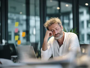 Stressed Professional in Modern Office Stressed Professional in Modern Office