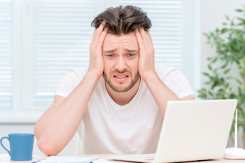 Stressed Young Man in Modern Home Office